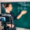 camera capturing lecturer at blackboard